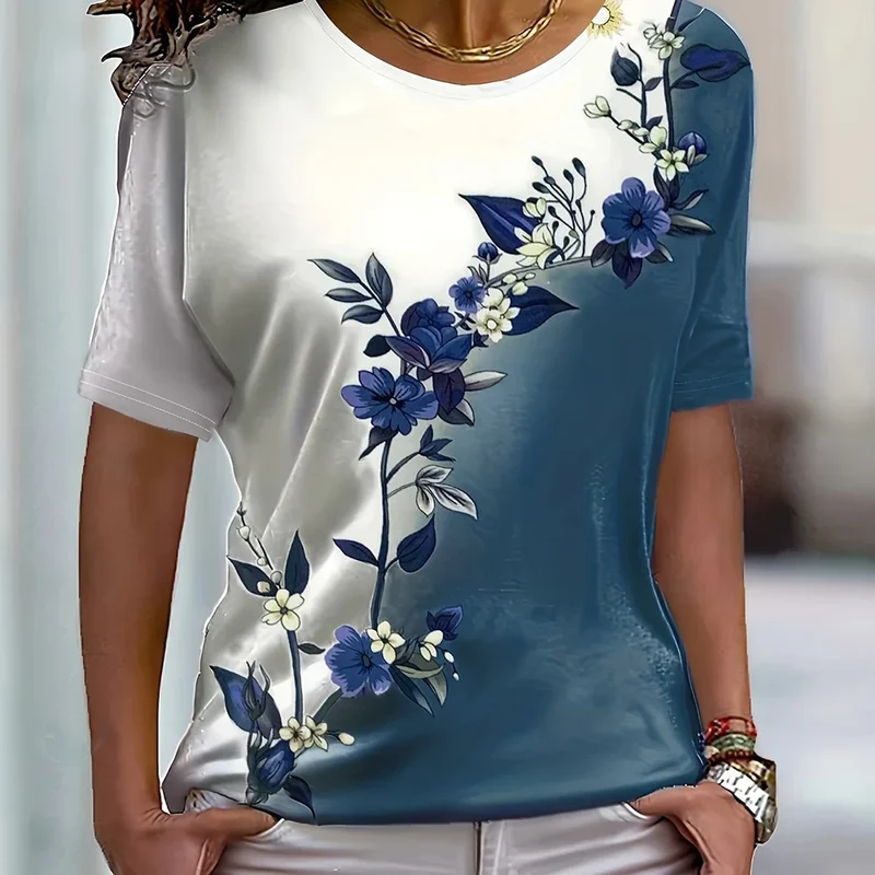 Camiseta feminina color block, modelo 2024, estilo verão, manga curta, estampa floral, modelagem solta, ideal para festas.